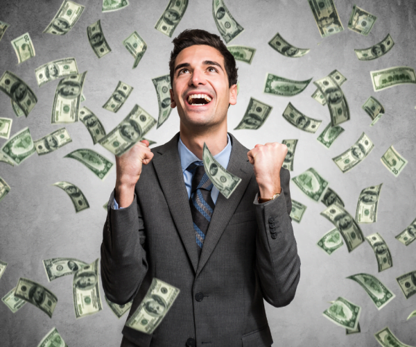 men_with_suite_raining_dollar_notes_millionaire