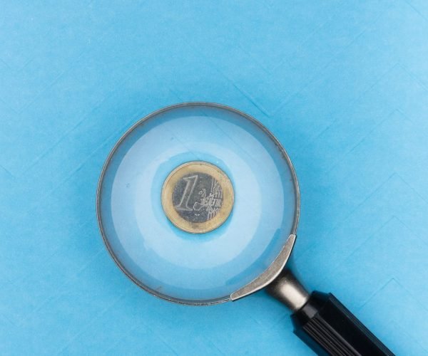 round grey and black magnifying glass