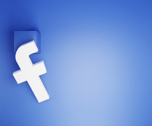 a white facebook logo on a blue background